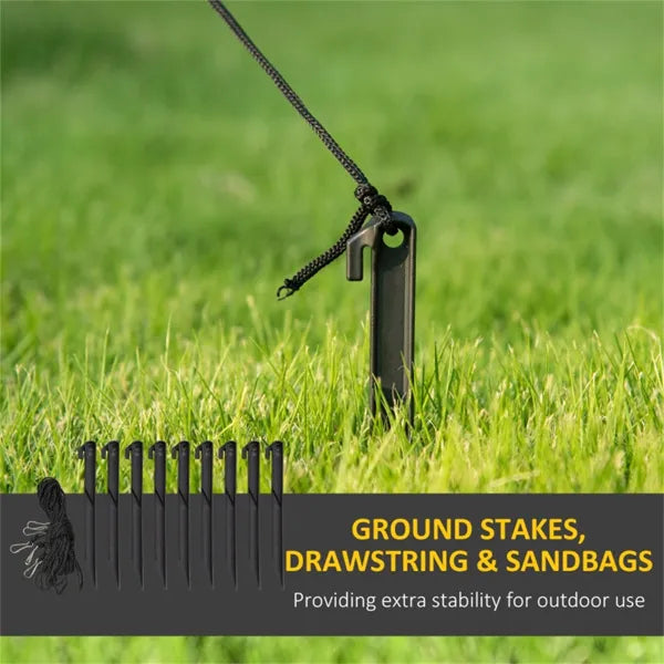 Black plastic ground stake with drawstring inserted in green grass for outdoor stability