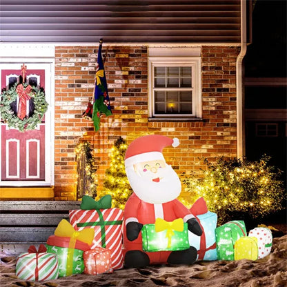 Inflatable Santa Claus Christmas yard decoration with LED lights surrounded by colorful presents in front of a brick house