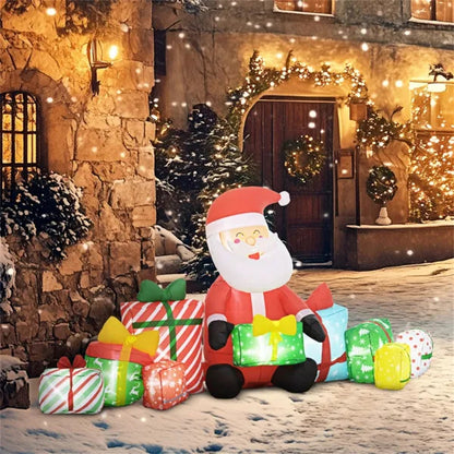 Inflatable Santa Claus yard decoration with LED lights surrounded by colorful Christmas presents in snowy outdoor setting