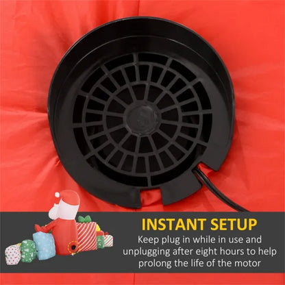 Close-up of black motor fan on red inflatable Santa Christmas yard decoration with LED lights
