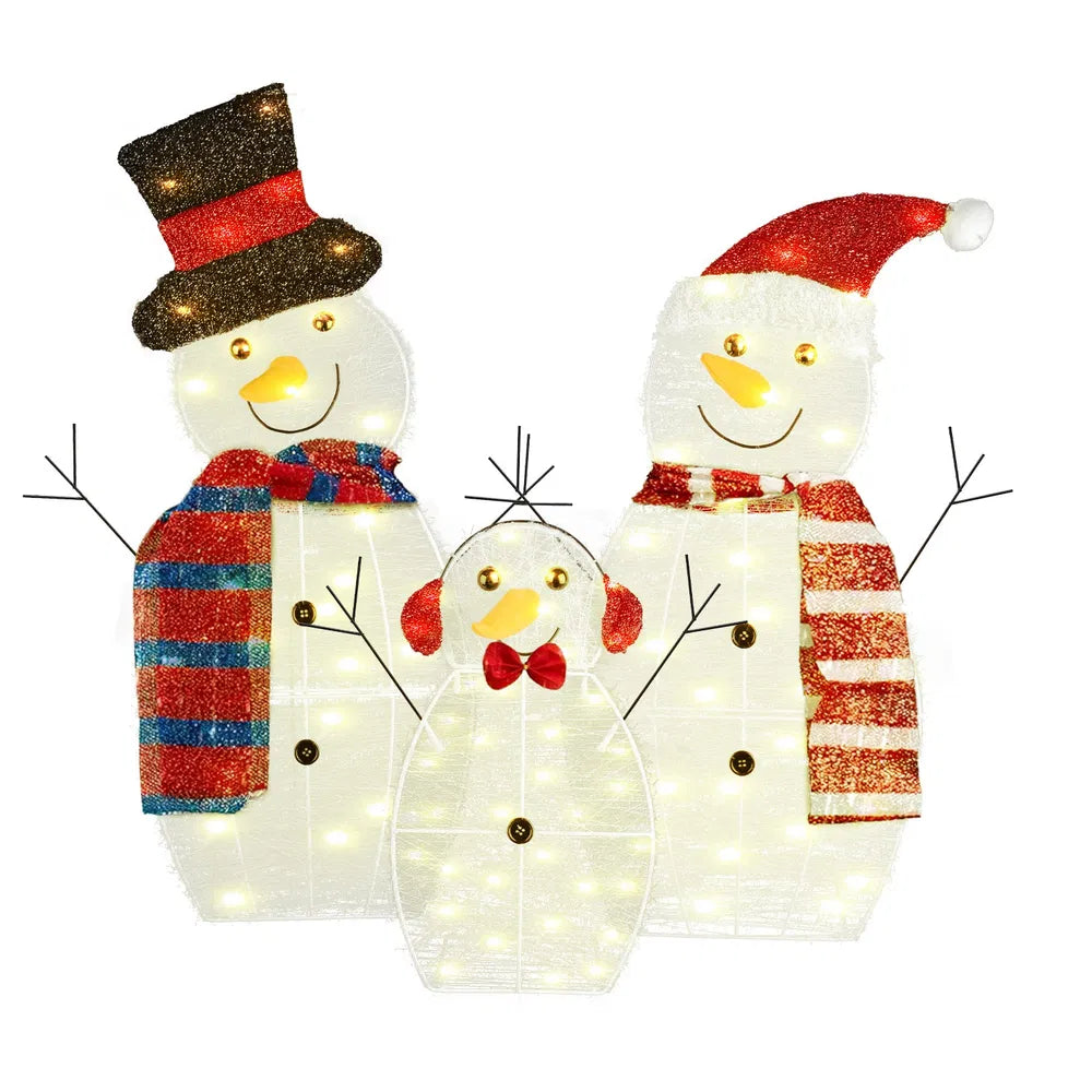LED-lit snowman family yard decoration with scarves, hats, and earmuffs
