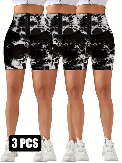 Three pairs of black and white tie-dye high-waisted scrunch butt lifting shorts with white sneakers