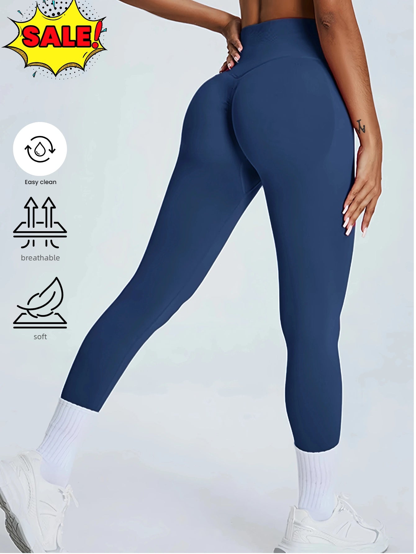 Rear view of person wearing navy seamless leggings with tummy control, white socks, and sneakers