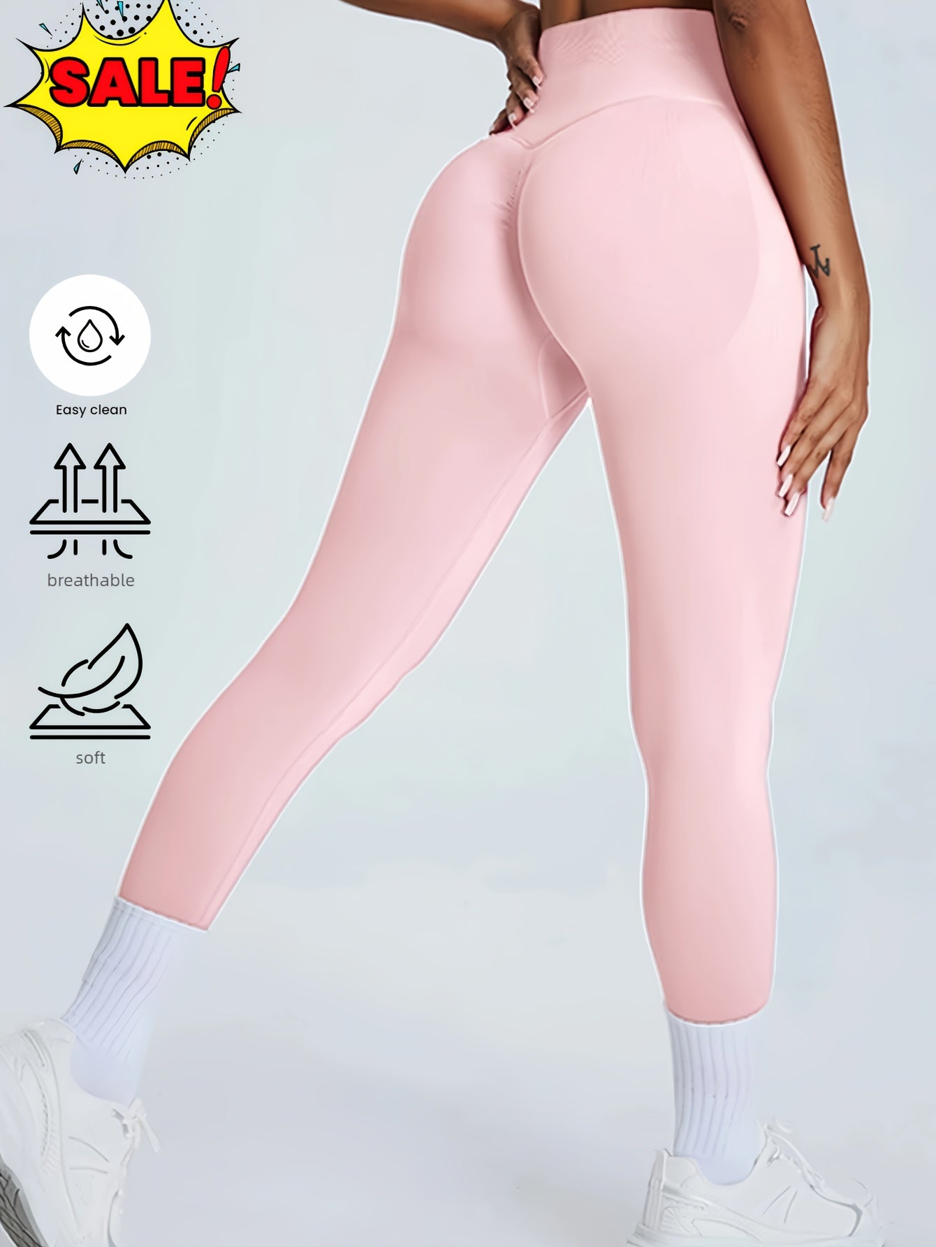Woman wearing pink seamless high-waisted leggings with tummy control, white socks, and sneakers
