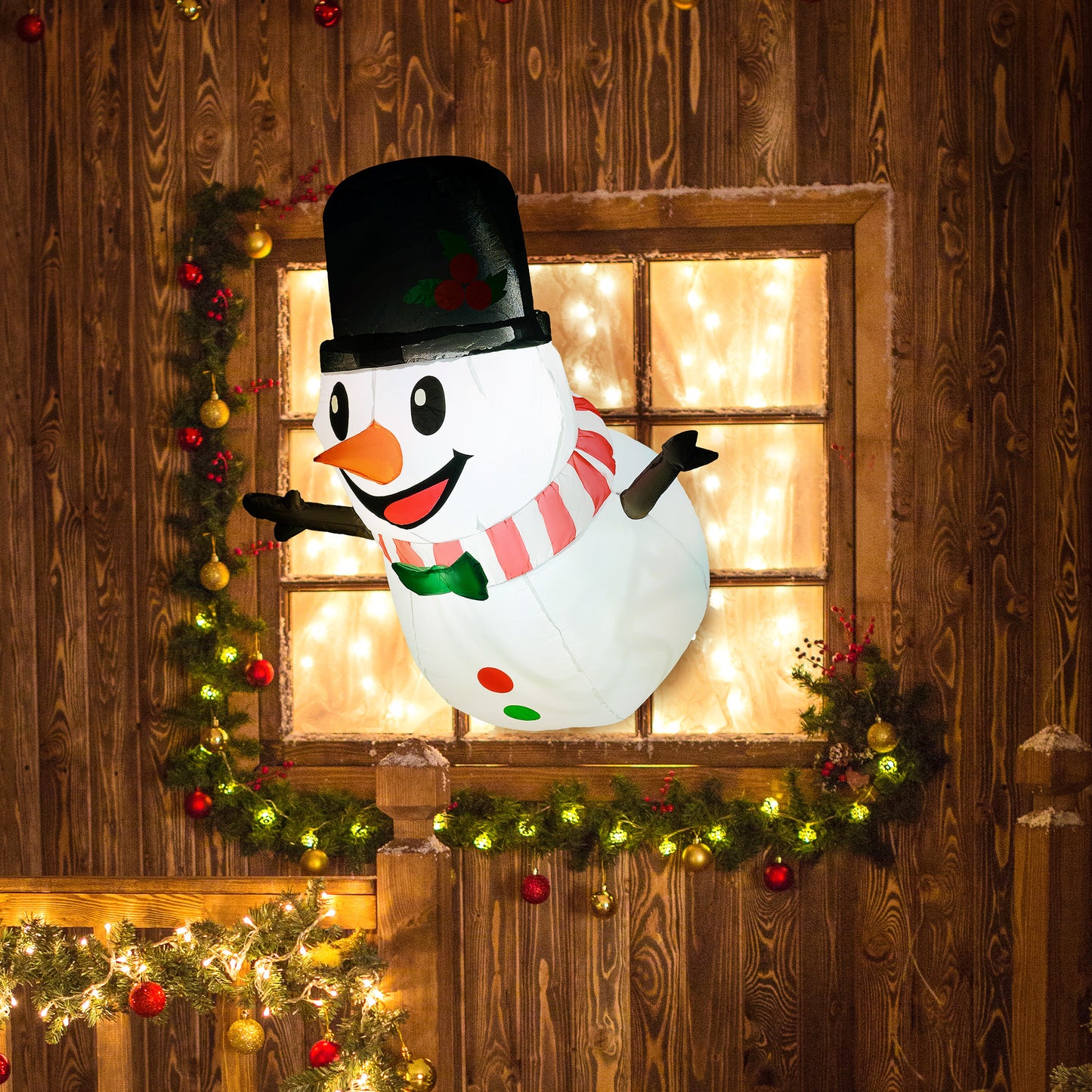 Inflatable smiling snowman with black top hat, red and white scarf, green bow tie, and lighted wooden window frame