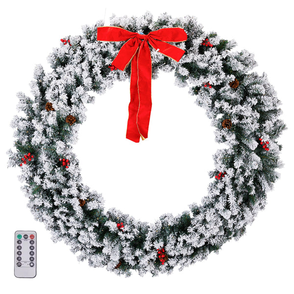 60-inch snow flocked Christmas wreath decorated with red berries, pine cones, red bow, and LED lights with remote