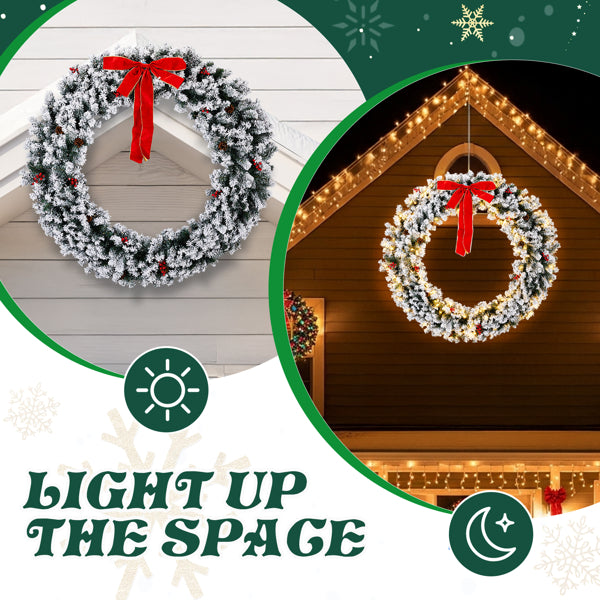 60-inch snow-flocked Christmas wreath with warm white LED lights and red bow on house exterior