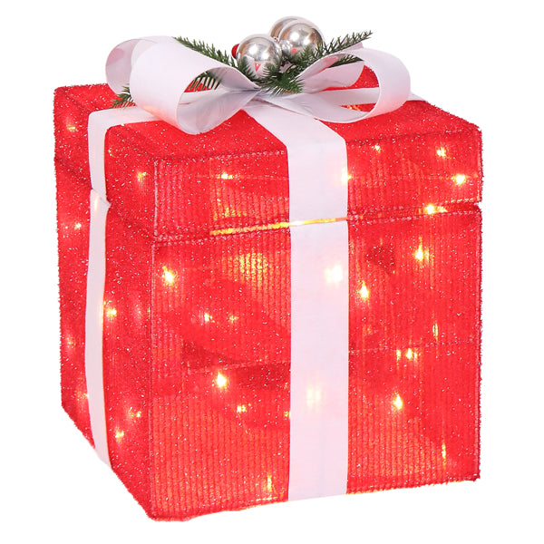 Red motorized pop-up gift box with white ribbon, silver ornaments, pine sprigs, and warm LED lights