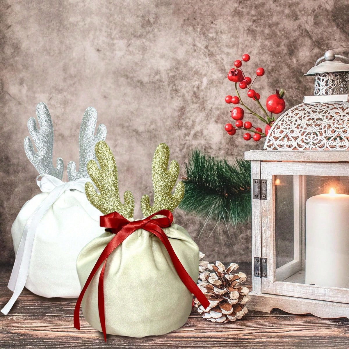 Christmas velvet drawstring gift pouches with glitter antlers, red ribbon, pinecone, and candle lantern