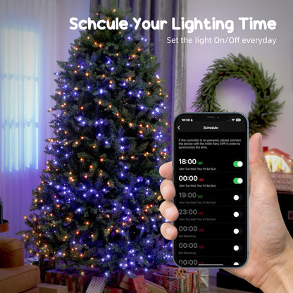 Prelit Christmas tree with blue and orange LED lights controlled by smart app scheduling lighting on/off