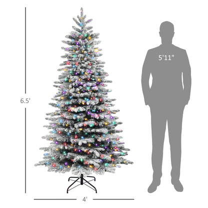 6.5ft snow flocked Christmas tree with multicolor LED lights and metal stand next to 5'11" silhouette