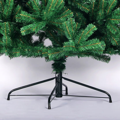 Close-up of green artificial spruce Christmas tree branches and black foldable metal stand on white background