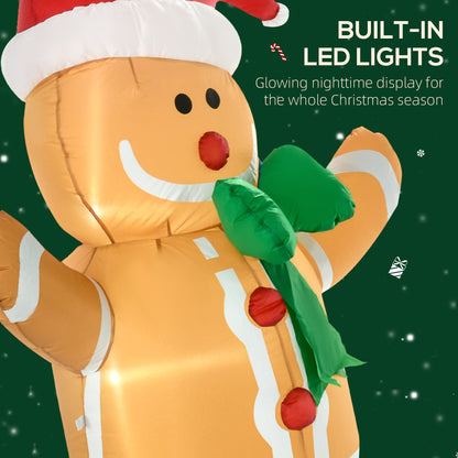 Inflatable gingerbread man Christmas decoration with built-in LED lights and green scarf on dark background