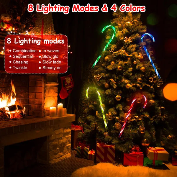 Christmas tree decorated with multicolor solar candy cane lights in a cozy room with a fireplace and gifts