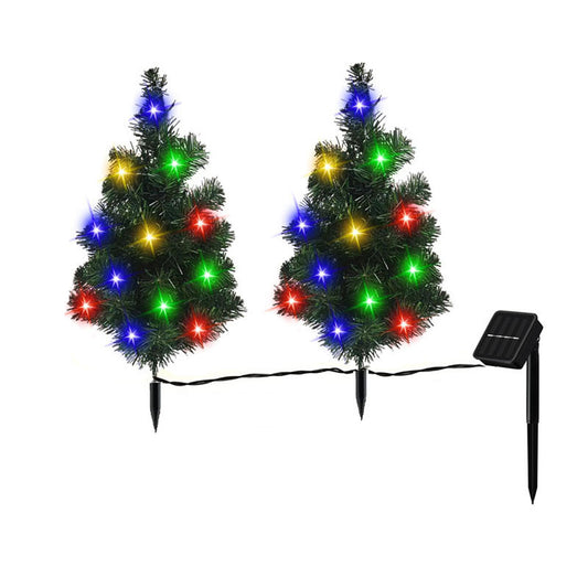 Two small artificial Christmas trees with multicolored LED solar lights and solar panel spikes