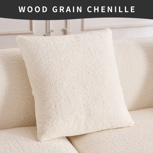 Cream wood grain chenille decorative pillow on matching textured sofa cushion