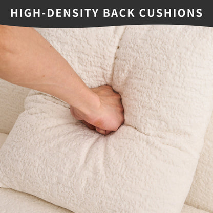 Hand pressing plush, high-density back cushions of a soft cream-colored sofa showcasing comfort and texture