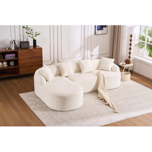 white curved modular sectional sofa with chaise in modern living room on beige rug