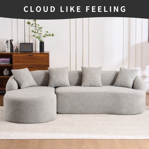 Modern light grey L-shaped modular sofa with chaise and five cushions in minimalist living room