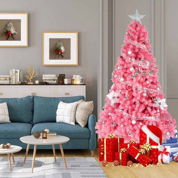 Pink 6ft PVC Christmas tree decorated with silver ornaments and star topper in modern living room