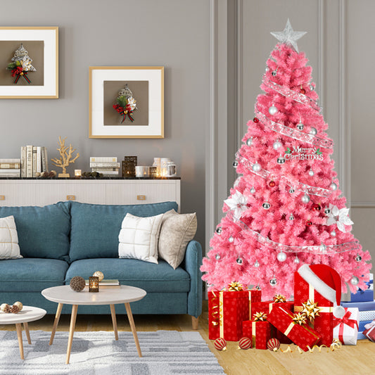 Pink 6ft PVC Christmas tree decorated with silver ornaments and star topper in modern living room