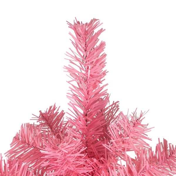 Close-up of pink PVC Christmas tree branches with textured needles on white background
