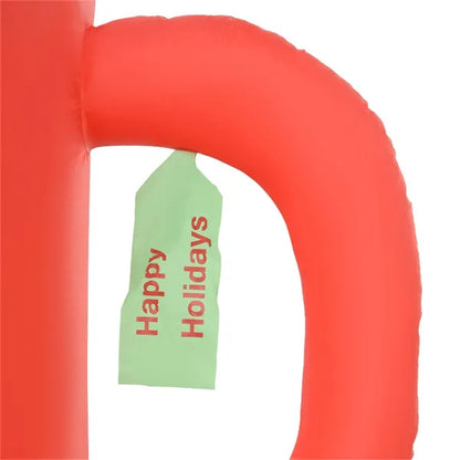 Inflatable red cup with green tag reading Happy Holidays, festive Christmas yard decor