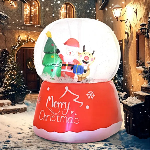 Inflatable red Christmas snow globe with Santa, reindeer, tree, and Merry Christmas text in snowy courtyard