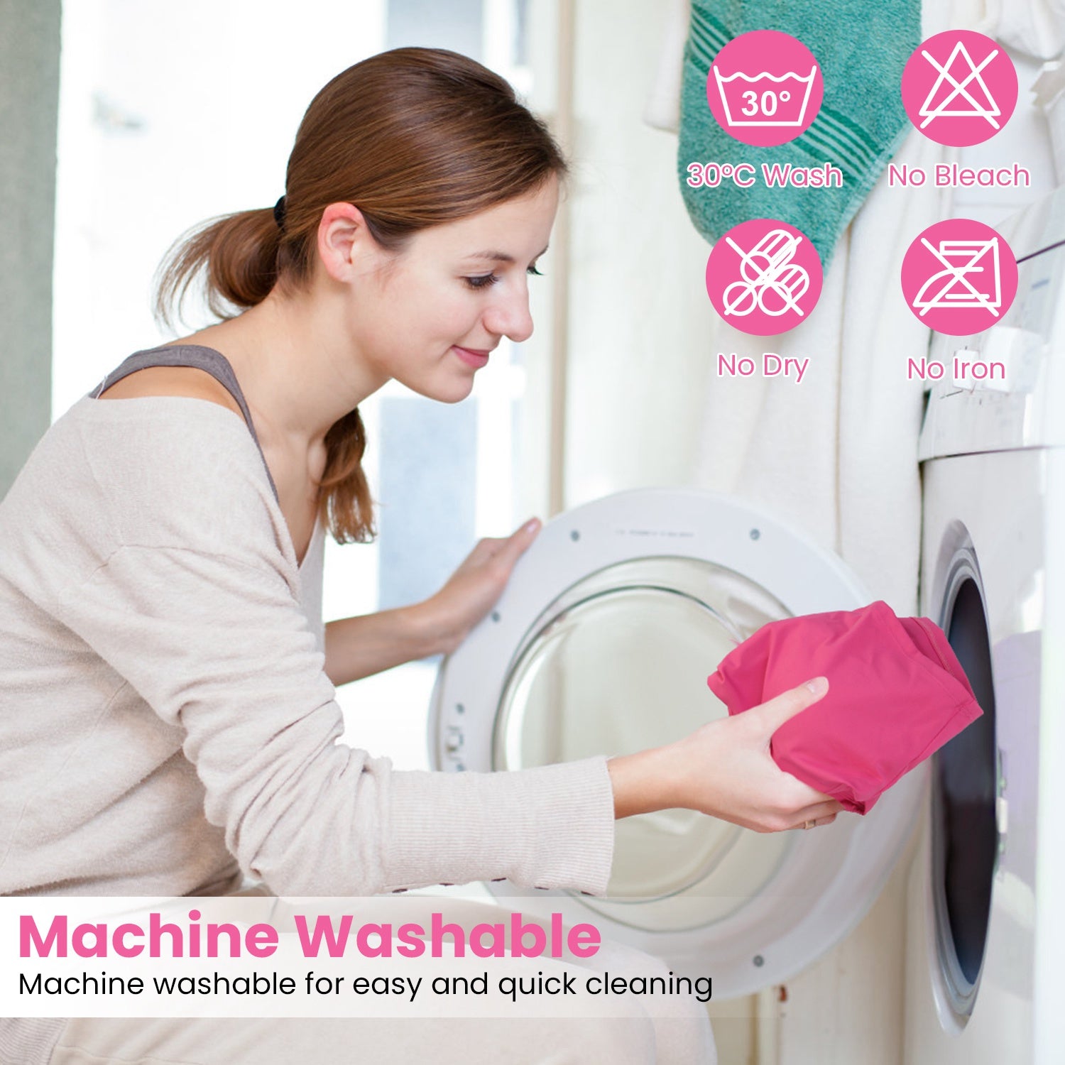 Woman loading pink sports bra into front-load washing machine with machine washable care icons