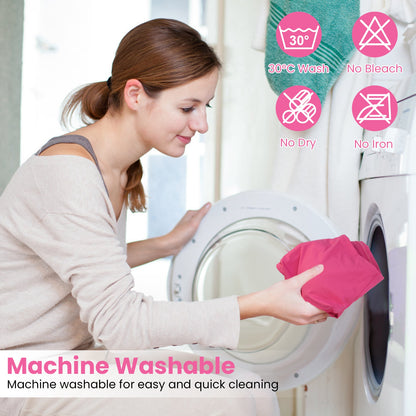Woman loading pink sports bra into front-load washing machine with machine washable care icons