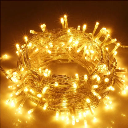 Coiled warm white waterproof LED string lights with clear wiring for outdoor decoration