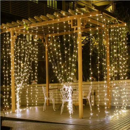 Warm white waterproof LED string lights hanging on wooden pergola outdoors at night for festive decoration