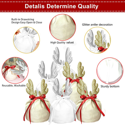 Christmas fabric gift bags in white and khaki with glitter antler decorations and red ribbons