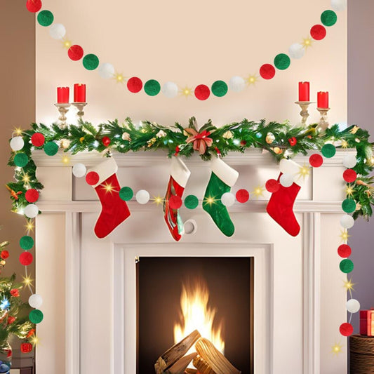 Christmas fireplace decorated with red, green, and white felt ball garlands, stockings, candles, and greenery
