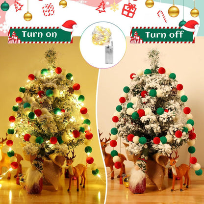 Small snowy Christmas tree decorated with red, green, and white felt ball garland and warm LED lights
