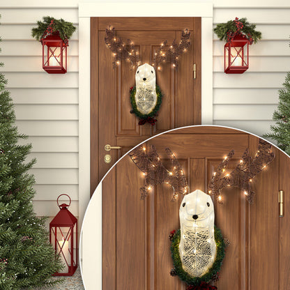 Christmas front door decorated with lighted reindeer head wreath with warm white LED lights and red lanterns