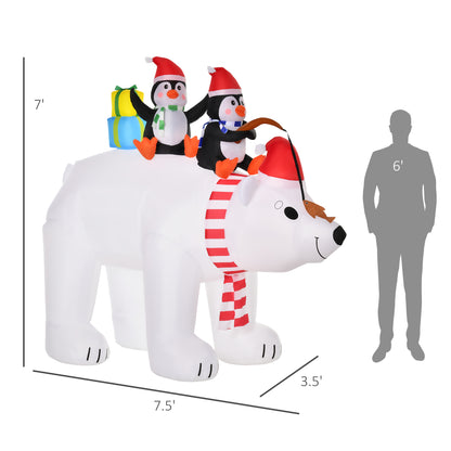 7-foot tall inflatable white polar bear with red striped scarf and Santa hat, carrying two penguins in Santa hats with gifts