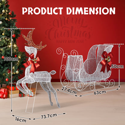 White LED wireframe reindeer and sleigh Christmas decorations with red bows and bells on wooden floor
