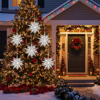 Snow-covered front porch with decorated Christmas tree and white snowflake ornaments glowing at night
