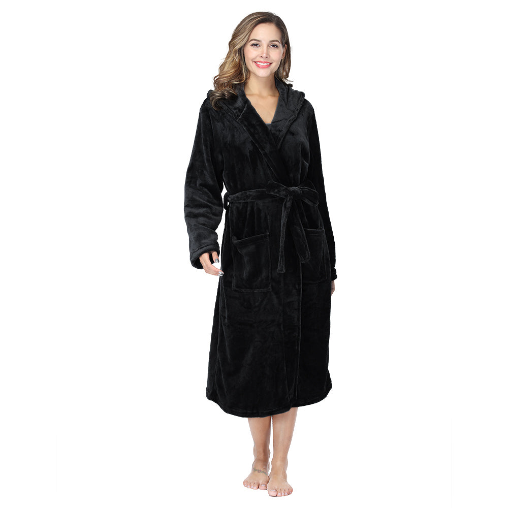 Woman wearing black plush fleece hooded robe with pockets and belt, warm winter loungewear